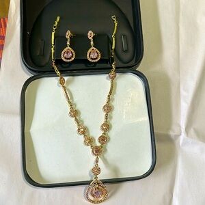 It is a very nice gold-plated stone necklace and earrings set.